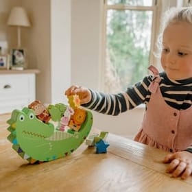 Child playing with Animals Balancing Game