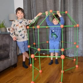 Children building a glow in the dark fort
