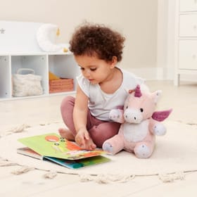 child playing with Lily the Dragon