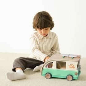 Child Playing with the Camper Van