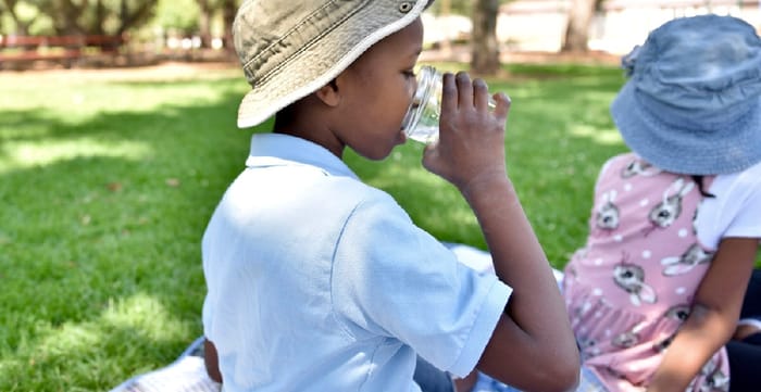 Children relaxing in the shade