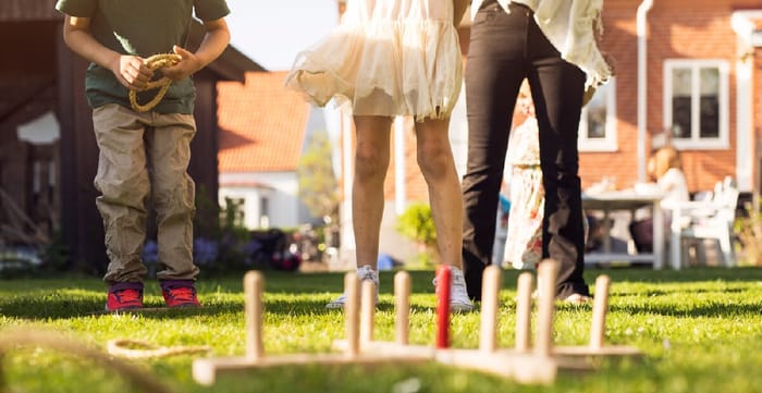 Family Playing Ring Toss in the Garden