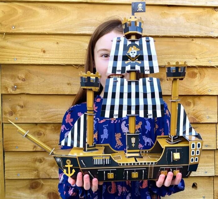 Girl holding pirate ship
