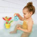 Child in the bath playing with Peek-a-Bee Tub Flower