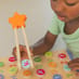 Child Playing with ABC's and Letter Sounds Wooden Puzzle Close Up