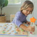 Child Playing with ABC's and Letter Sounds Wooden Puzzle